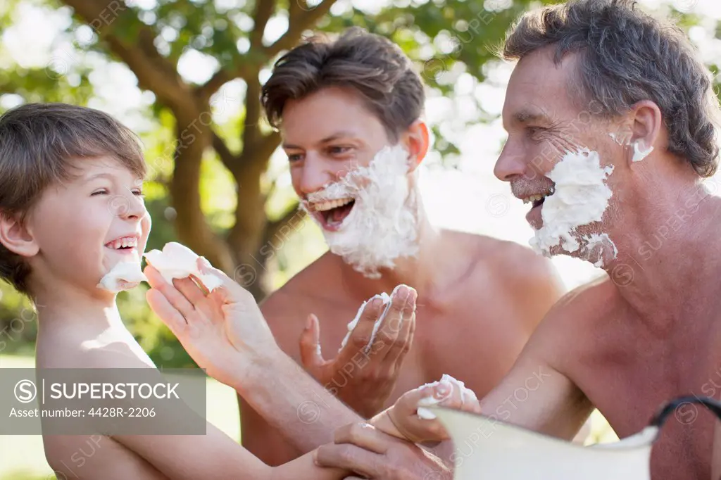 Cape Town, Playful multi-generation men applying shaving cream to faces
