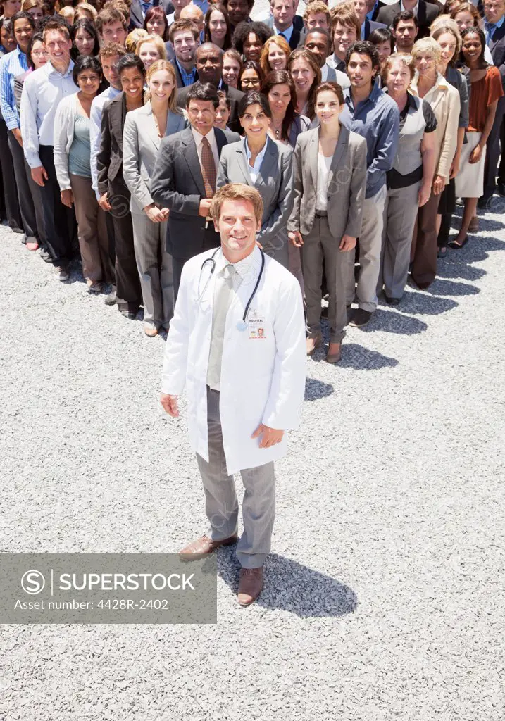 Cape Town, South Africa, Portrait of confident doctor with business people in background