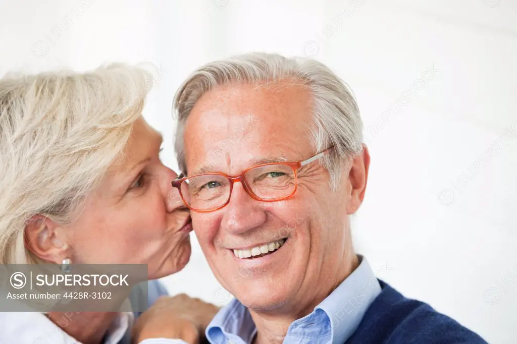Smiling woman kissing husband,Hamburg, Germany