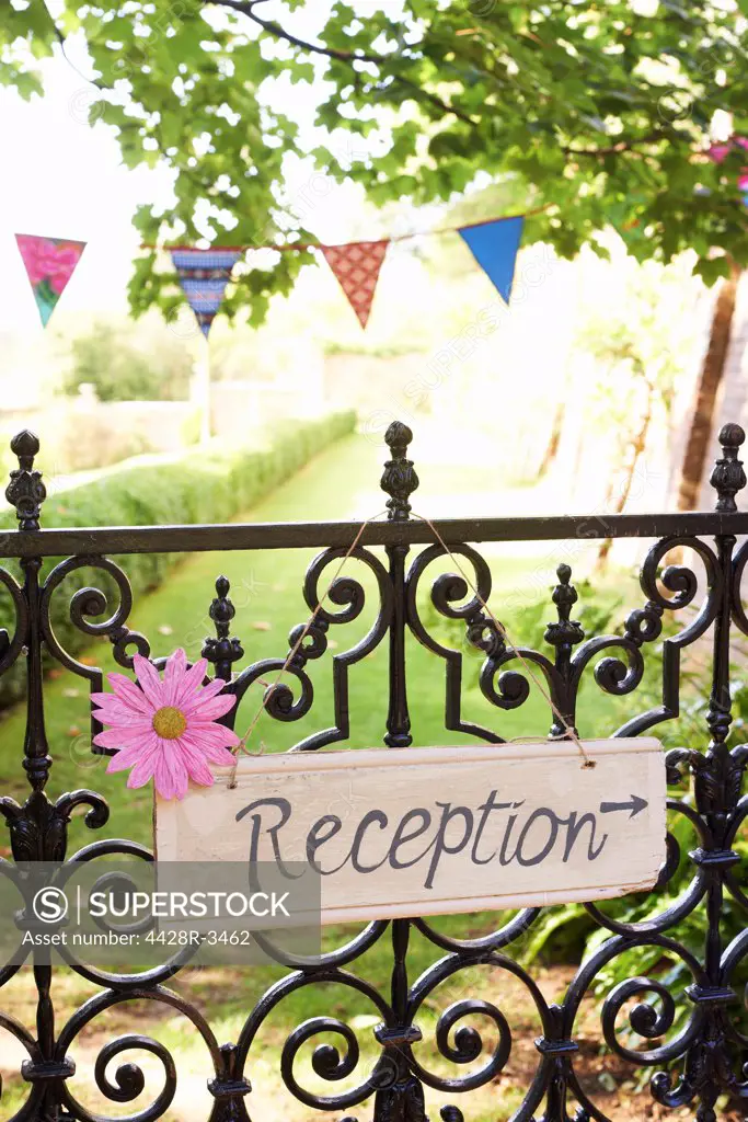 Reception' sign on wrought iron fence,belmonthouse, UK