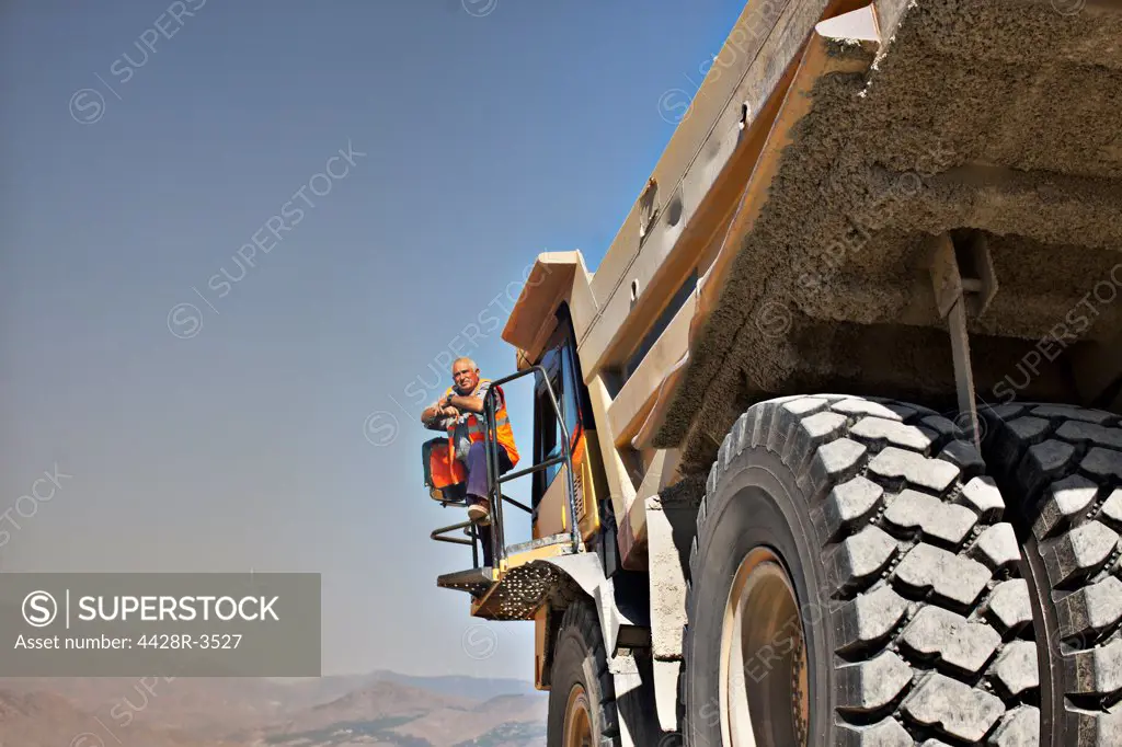 Worker standing on machinery, Spain