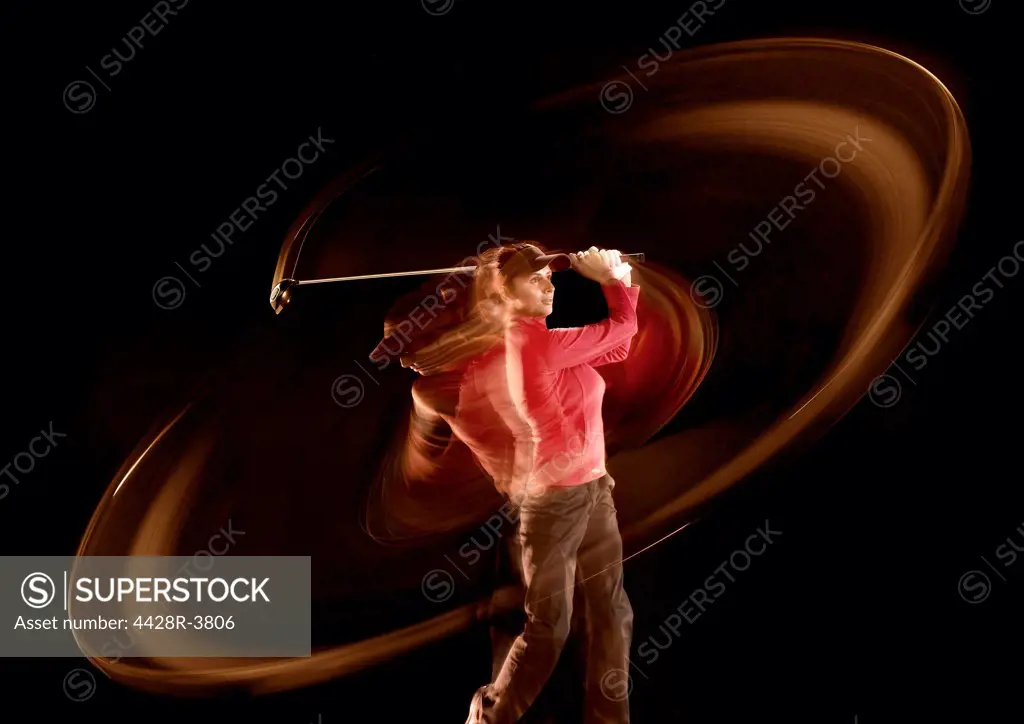 Time lapse view of golfer swinging,Studio