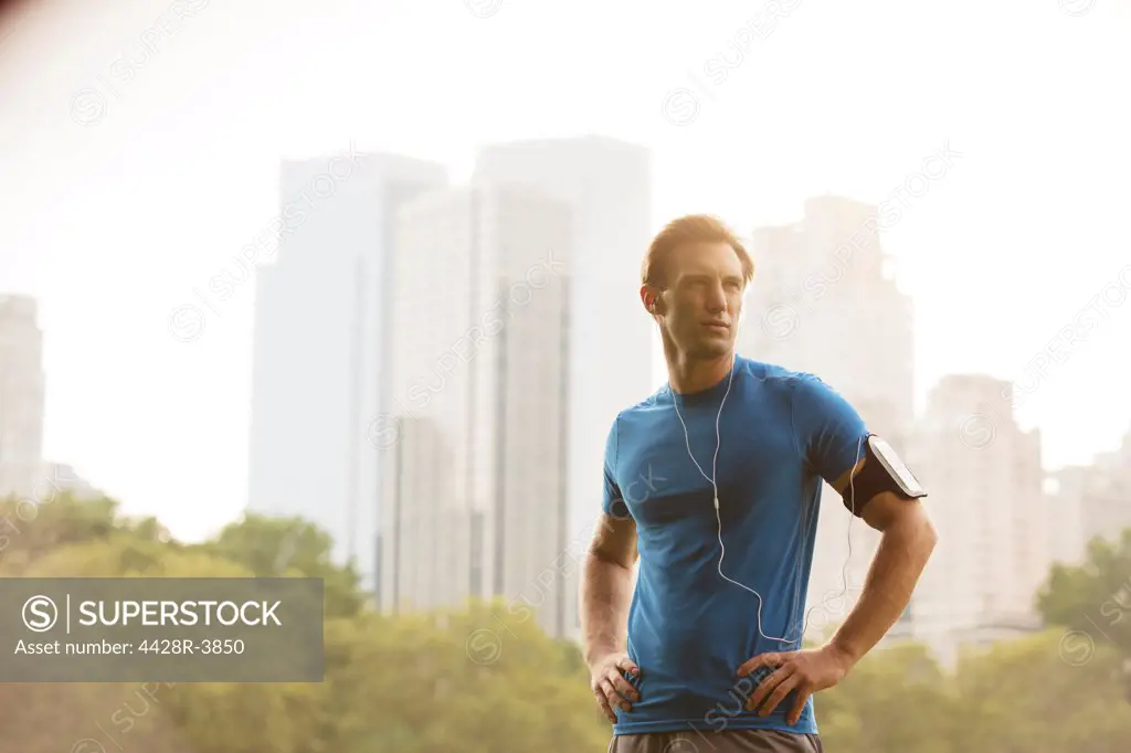 Runner standing in urban park,New York