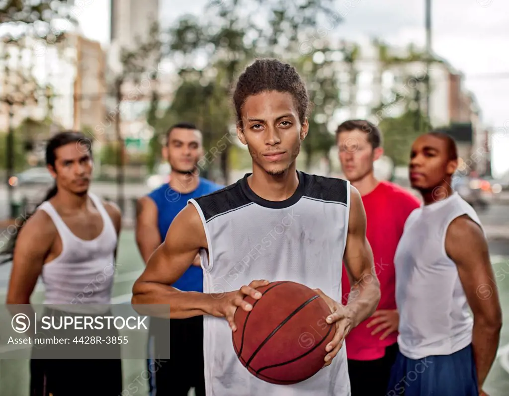 Men standing on basketball court,New York