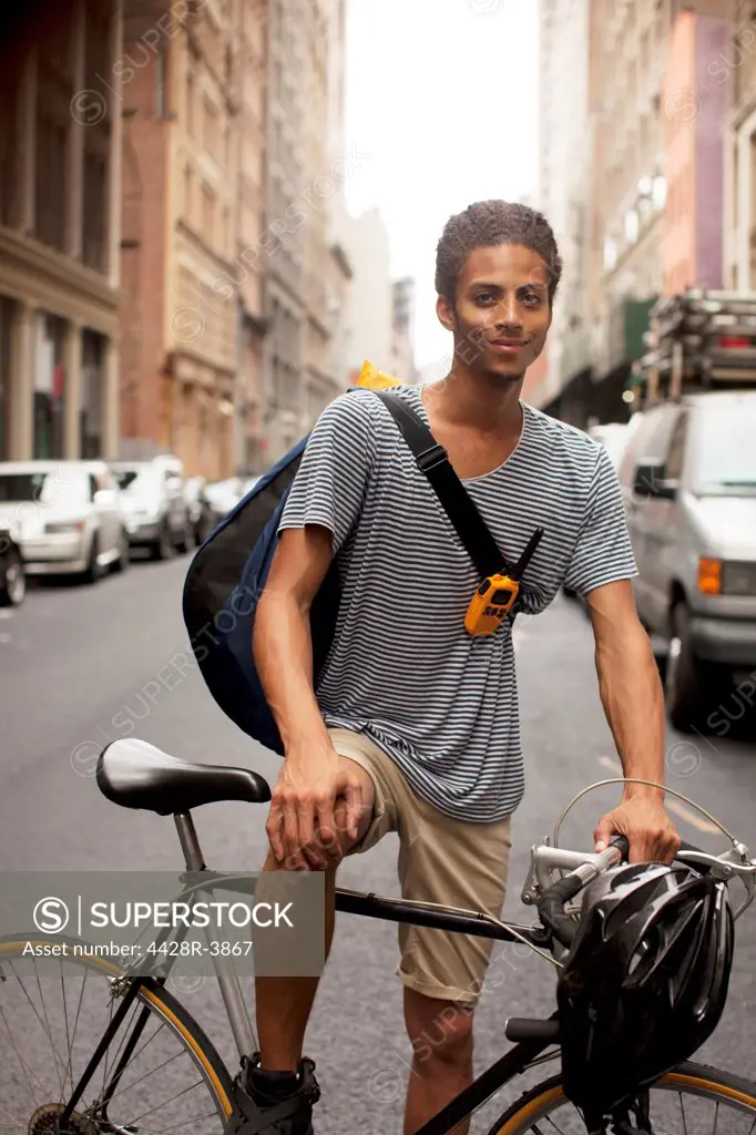 Man on bicycle on city street,New York