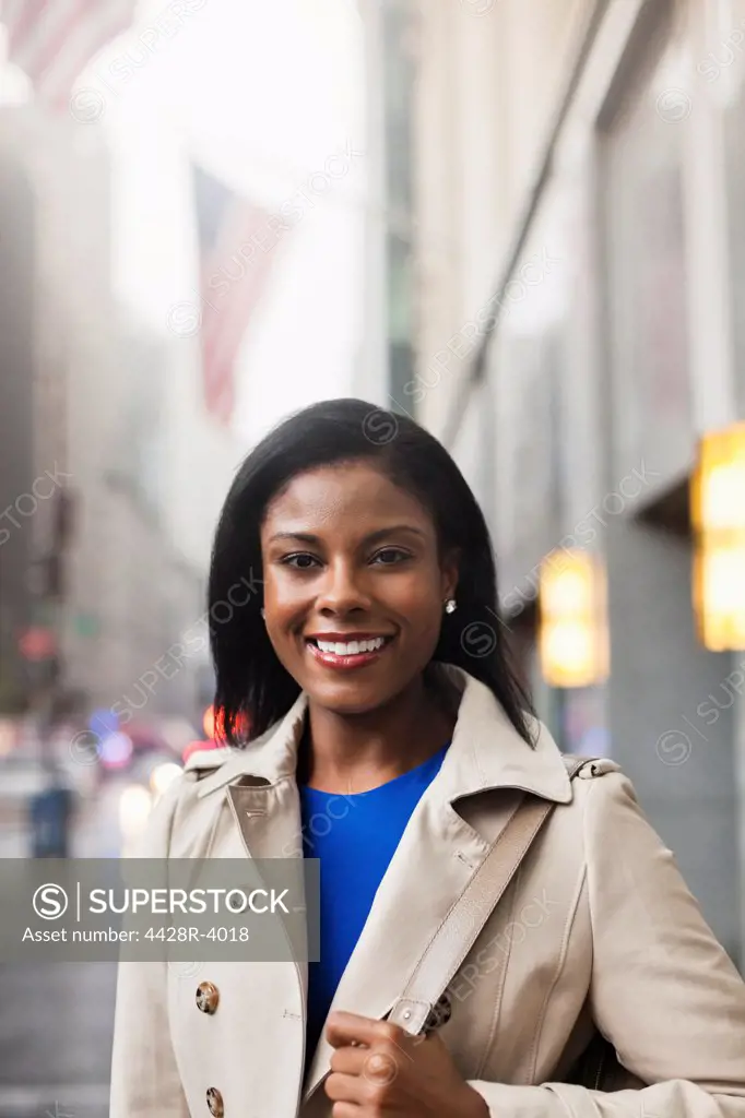 Businesswoman smiling on city street,New York