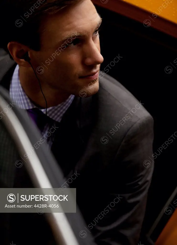 Businessman climbing out of taxi,New York