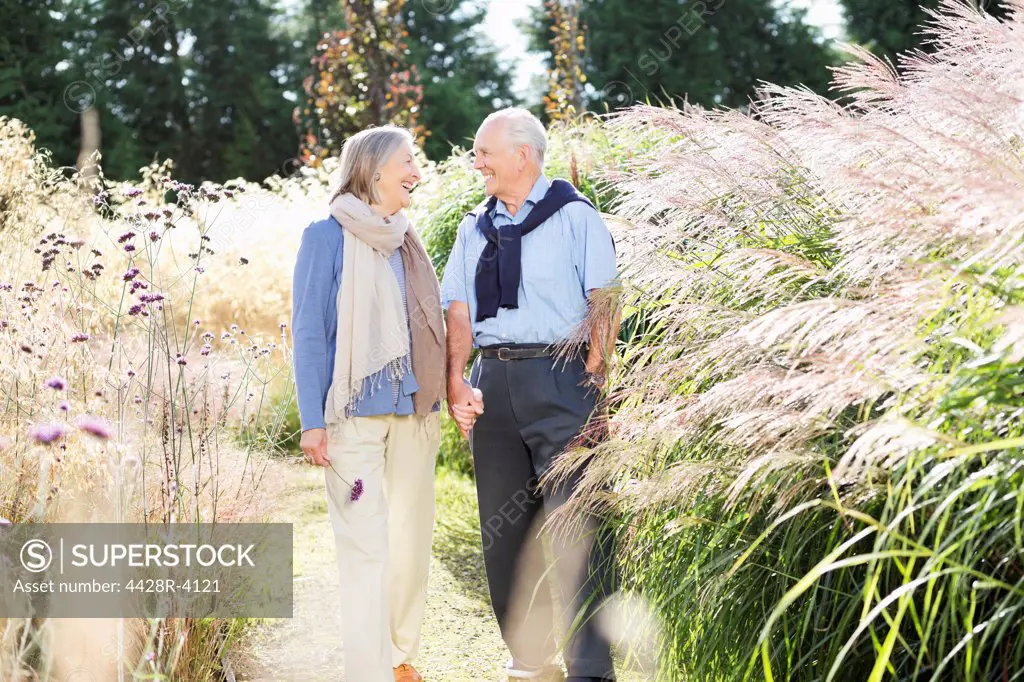 Older couple walking outdoors,East Grinstead, UK