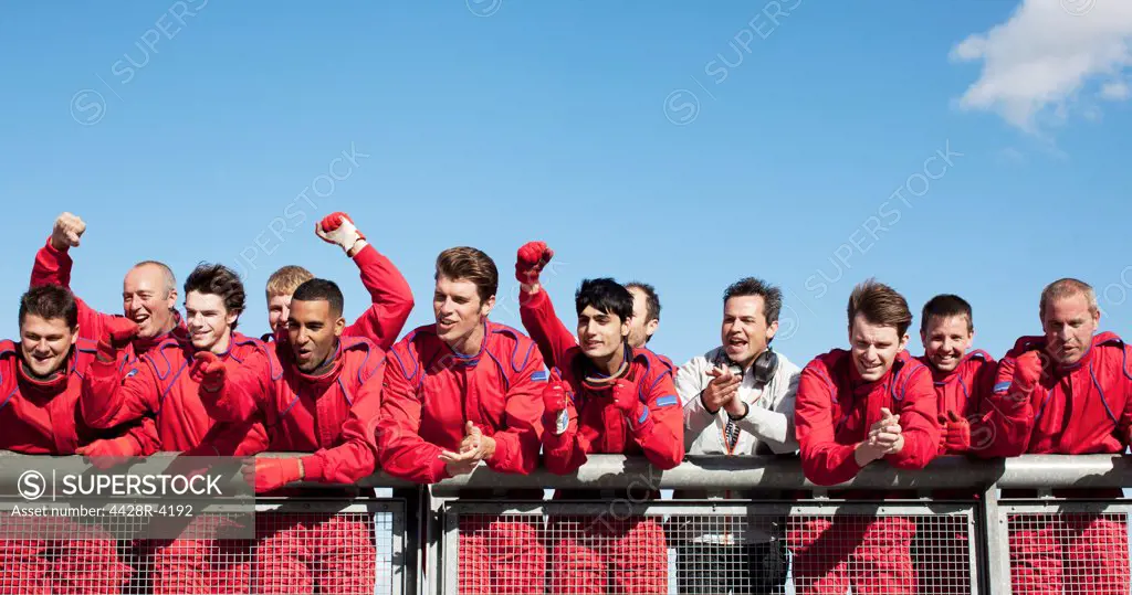Racing team cheering on sidelines,Corby, UK