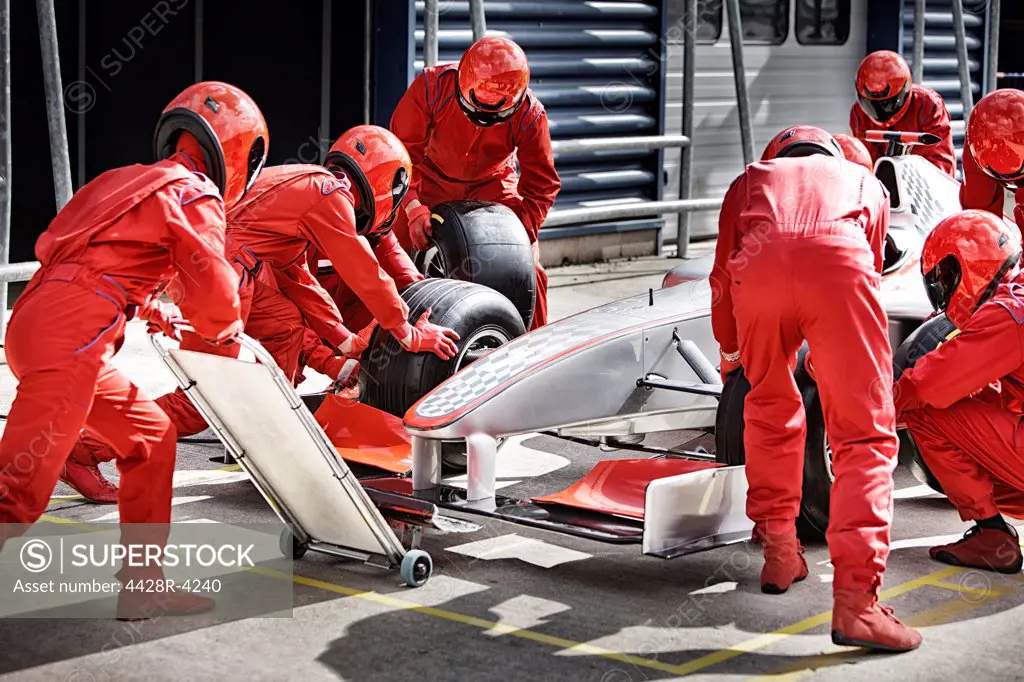 Racing team working at pit stop,Corby, UK