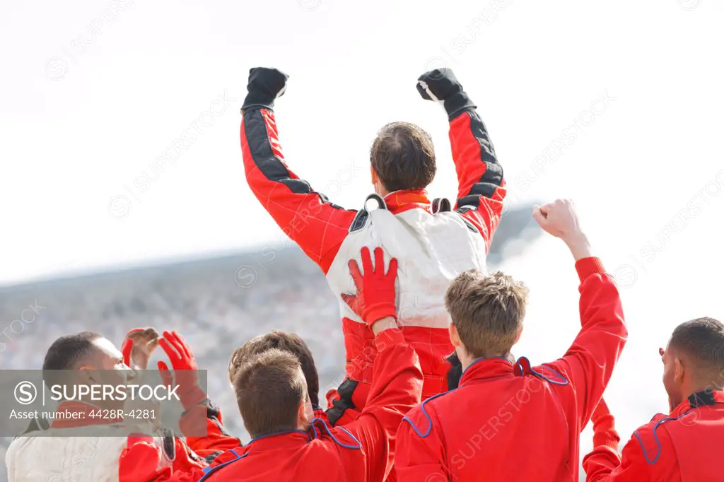 Racer and team cheering on track,Corby, UK