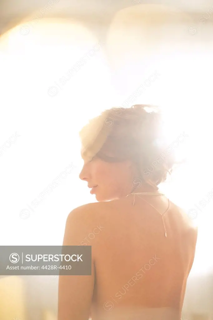 Nude woman looking over her shoulder,London, UK
