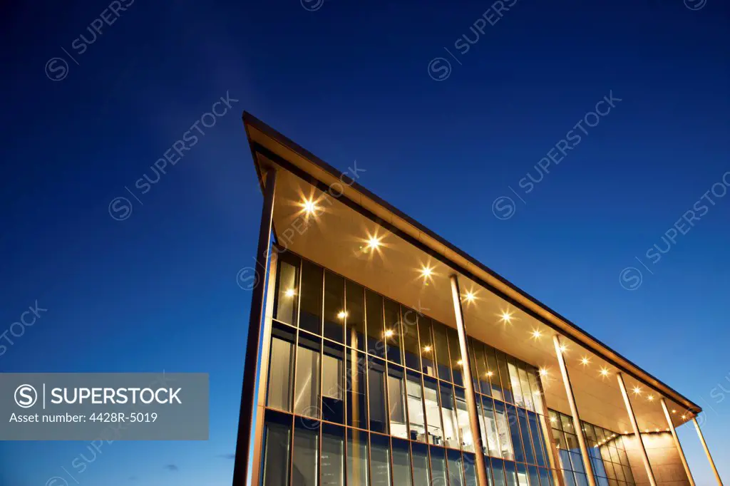 Modern building illuminated at dusk,Farnborough, United Kingdom