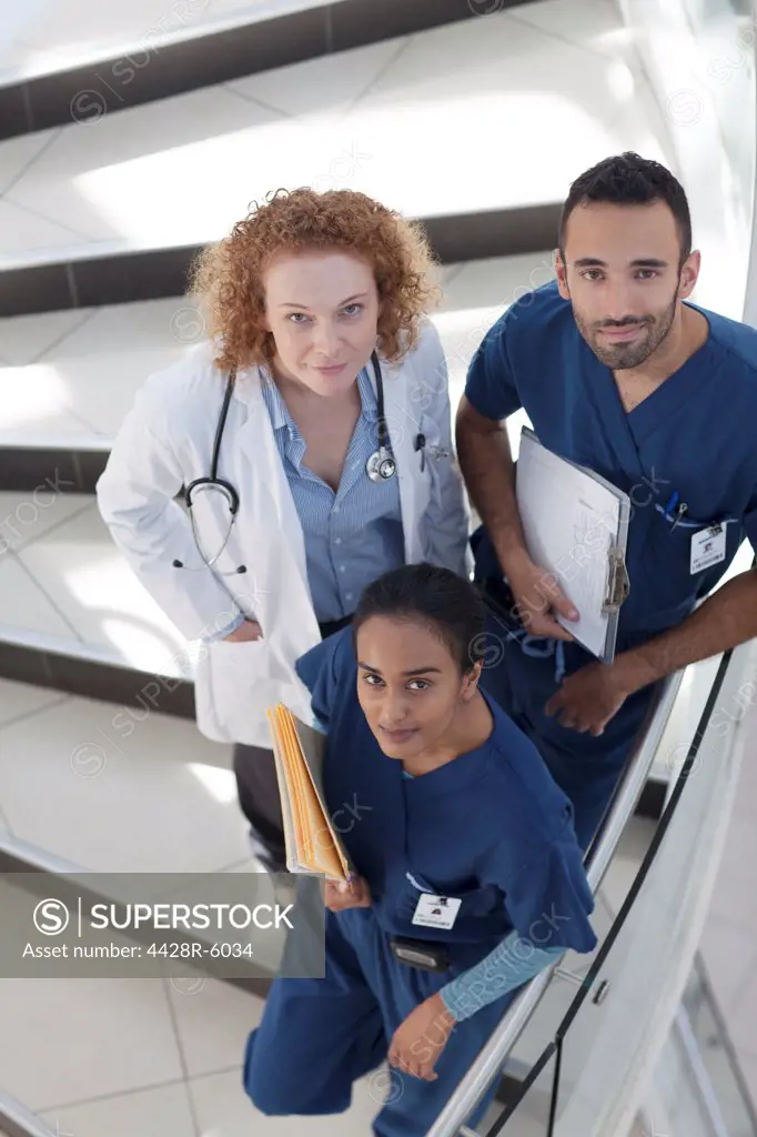 Doctor and nurses on hospital steps