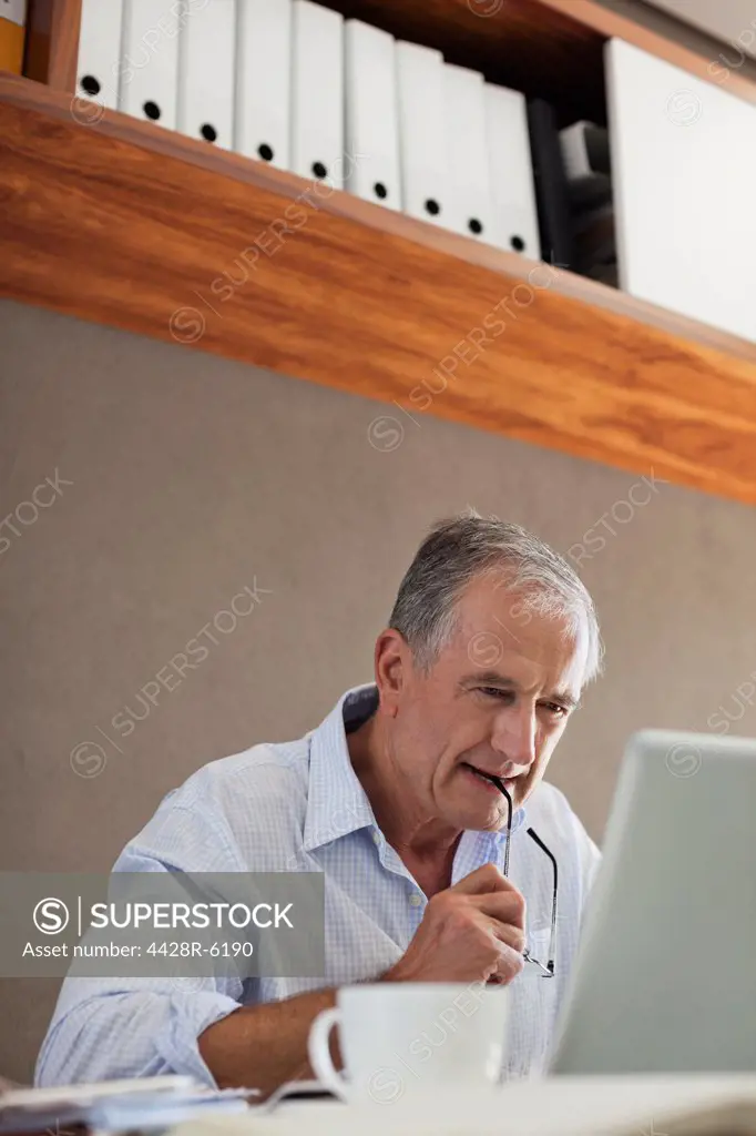 Older man working at desk