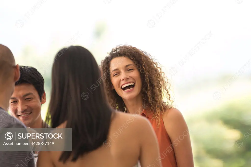 Friends talking at party