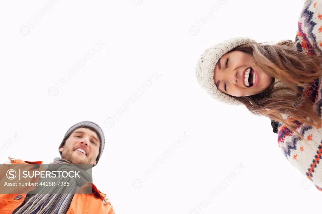 Low angle portrait of laughing couple