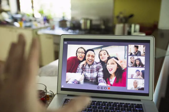 POV Friends video chatting on laptop screen