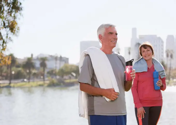 Los Angeles, USA, Older couple drinking water after workout