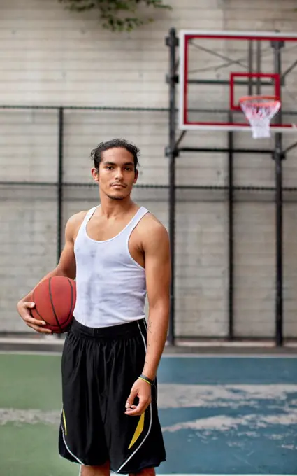 Man standing on basketball court,New York