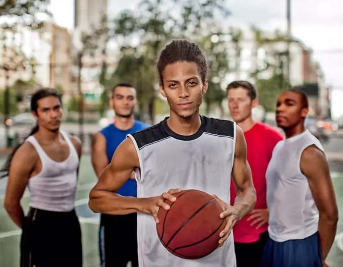 Men standing on basketball court,New York