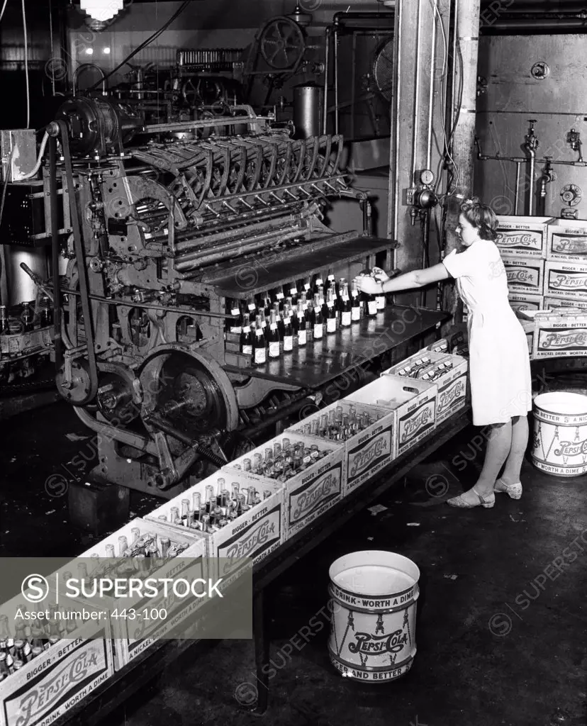 Side profile of a woman working in a bottling plant