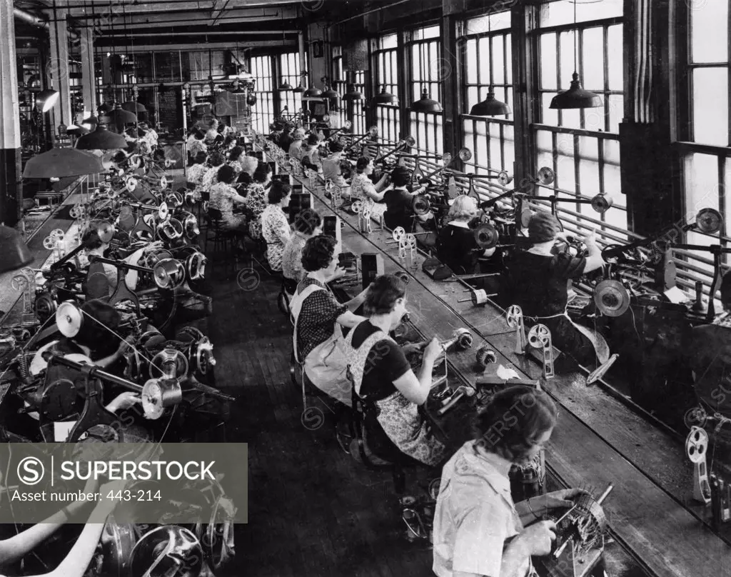 High angle view of a group of women working in a factory, 1940s
