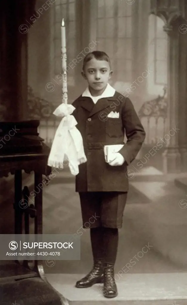 religion christianity catholic festivities Comunion boy with candel Germany circa 1910 catholic fashion shorts,