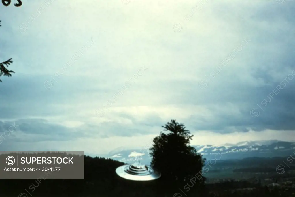 astronautics unidentified flying object (UFO) flying ufo show flight of Semjas space ship around a fir tree Switzerland 9.7.1975,
