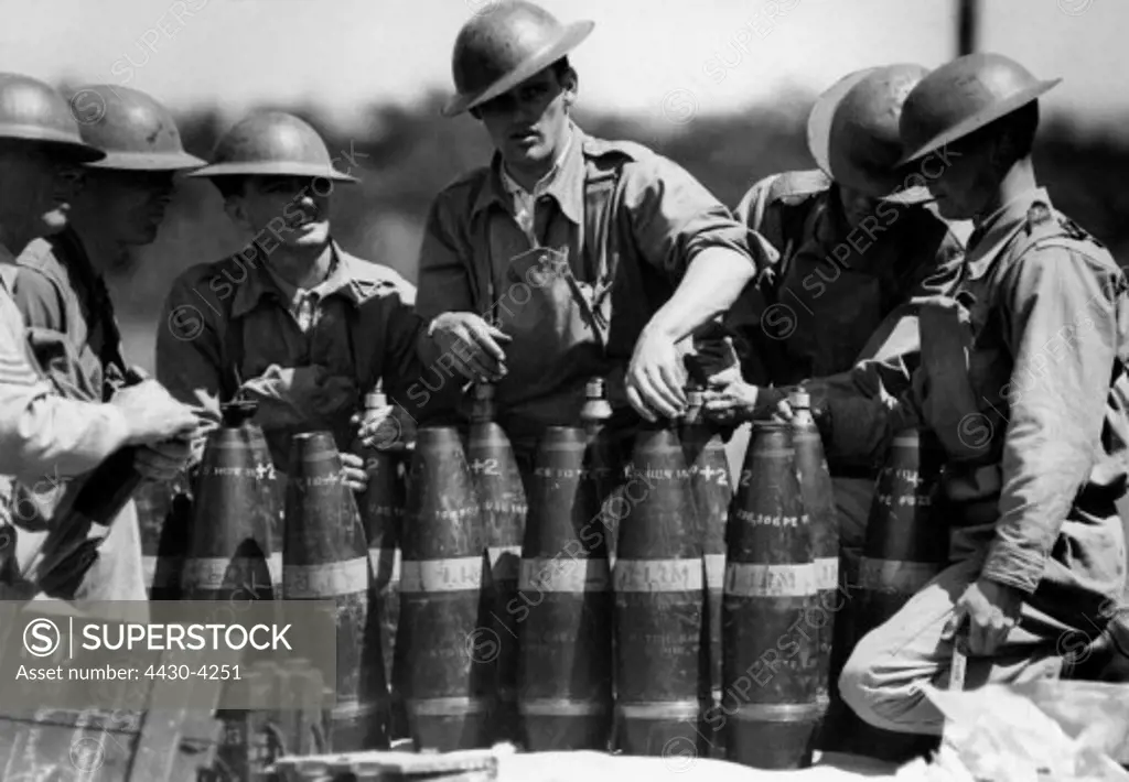 military Australia artillerymen during their training circa 1940 mounting fuzes on artillery shells,