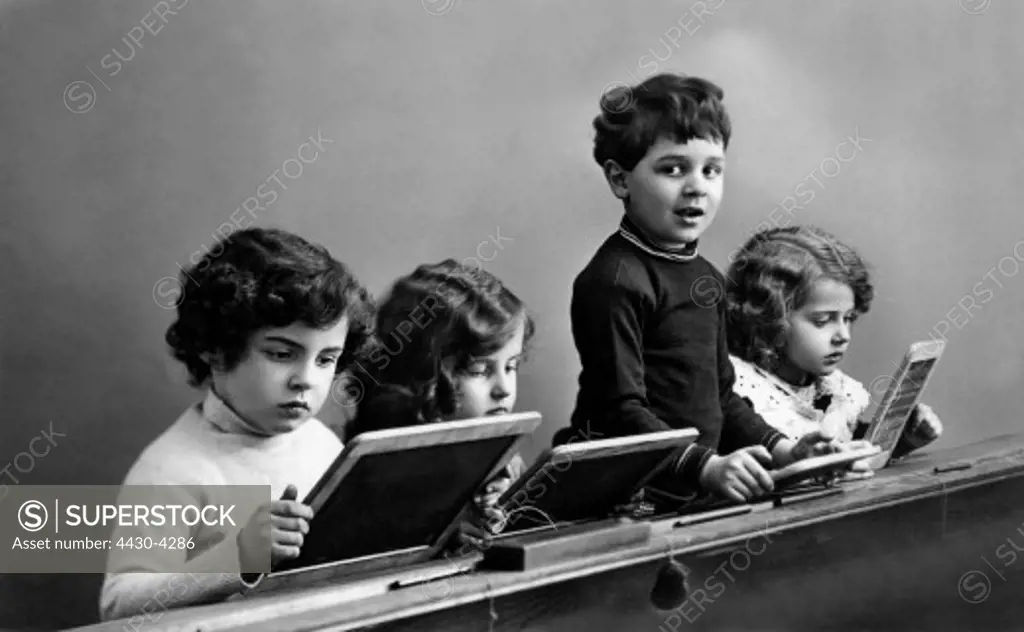 people children school four little children at a school desk picture postcard 1916,