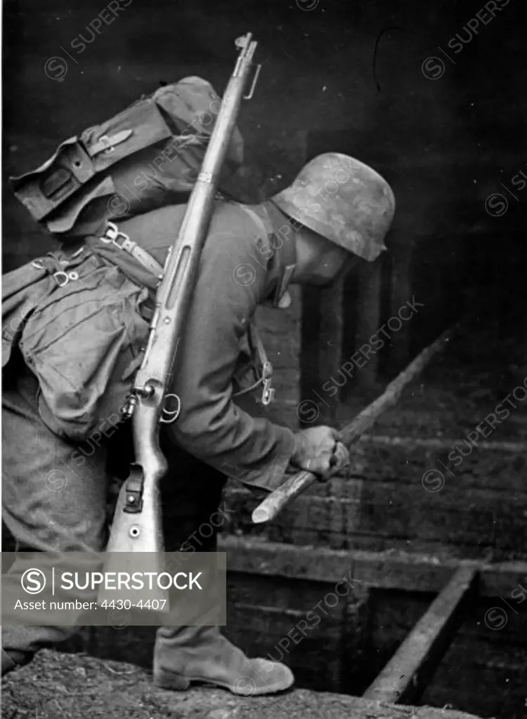 Nazism National Socialism military Wehrmacht army assault pioneers German assault pioneer placing an explosiv charge in the loophole of a bunker manoeuvre 15.8.1940,