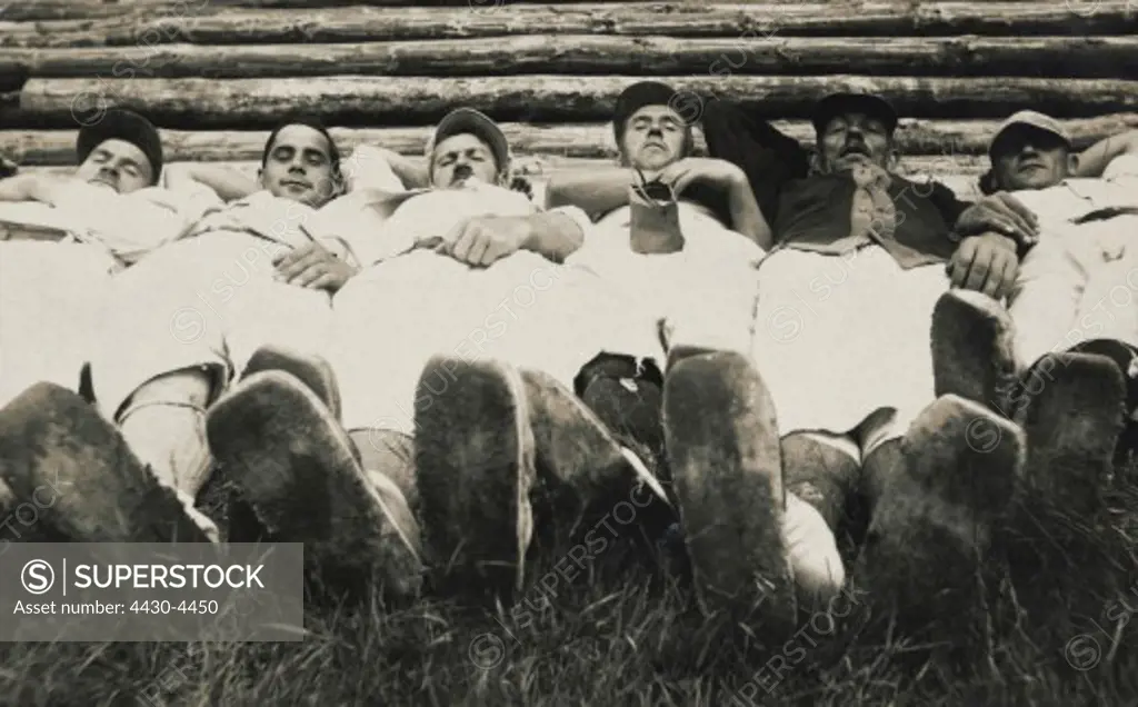 people group of resting men 1920s 20s 20th century,