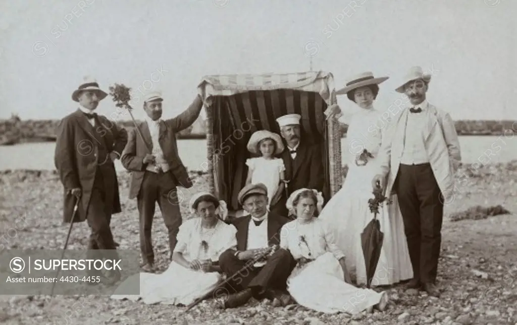 leisure group of people on the beach circa 1910 20th century,