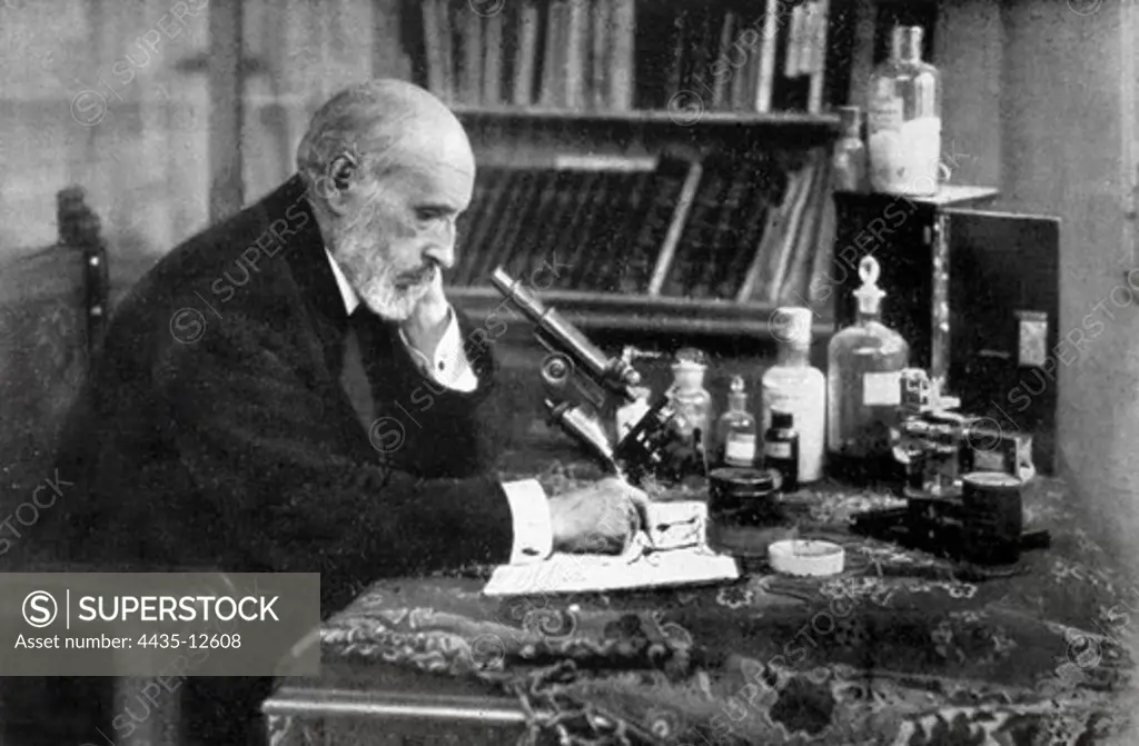 RAMON Y CAJAL, Santiago (1852-1934). Spanish doctor and histologist, Nobel Prize in 1906. Working in his studio.