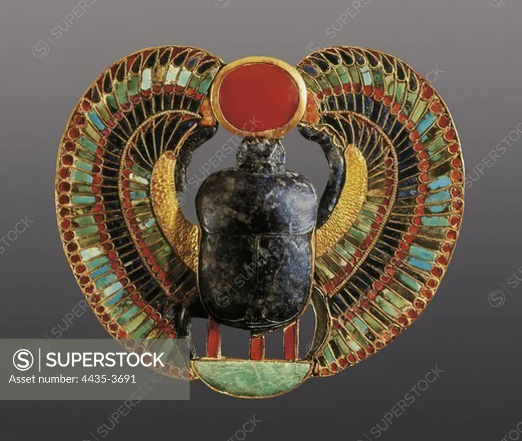 Scarab pectoral. 1361 -1352 BC. It represents the figure of a scarab (Kepri), symbol of the immortality. Made in gold, lapis-lazuli, amber and other precious stones. It belongs to the Treasure of Tutankhamun. Egyptian art. New Kingdom. Jewelry. EGYPT. CAIRO. Cairo. Egyptian Museum. Proc: EGYPT. QUENA. Dayr al-Bahri. Valley of the Kings. Tomb of Tutankhamun.