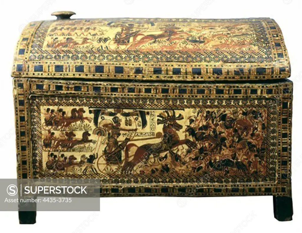 Painted chest depicting a king on his chariot attacking an enemy. ca. 1340 BC. Found at the Treasure of Tutankhamun. Painted wood. Small chest for sandals. Egyptian art. New Kingdom. Furniture. EGYPT. CAIRO. Cairo. Egyptian Museum. Proc: EGYPT. QUENA. Dayr al-Bahri. Valley of the Kings. Tomb of Tutankhamun.