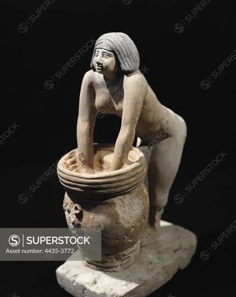 Woman making beer. ca. 2465 BC. Servant preparing beer. Egyptian art. Old Kingdom. Terra-cotta. EGYPT. CAIRO. Cairo. Egyptian Museum. Proc: EGYPT. CAIRO. Saqqara.