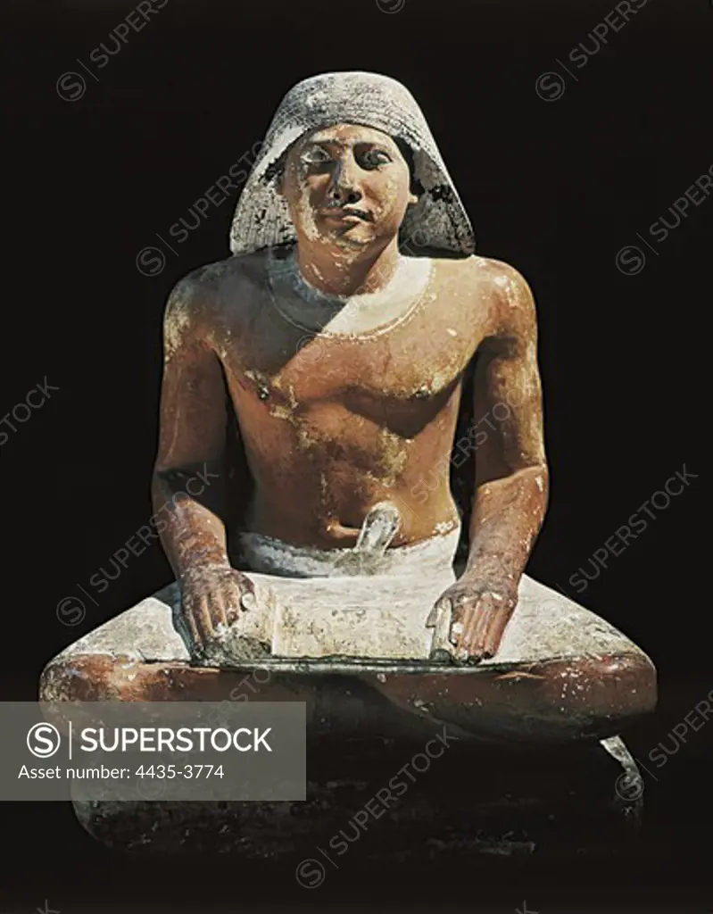 The royal scribe. 2575 BC. From the 5th Dynasty. Egyptian art. Old Kingdom. Sculpture on rock. EGYPT. CAIRO. Cairo. Egyptian Museum.