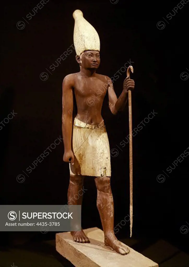 Statue of Sesostris I. 1971 -1928 BC. The Pharaoh appears here with a White Crown from the Upper Egypt. Painted cedarwood. Egyptian art. Middle Kingdom. Sculpture on wood. EGYPT. CAIRO. Cairo. Egyptian Museum.