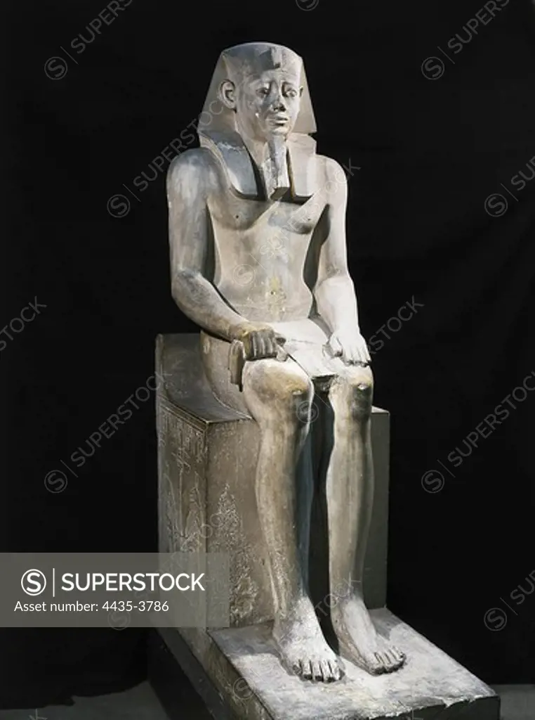 Seated statue of Sesostris I. 1971 -1928 BC. Egyptian art. Middle Kingdom. Sculpture on rock. EGYPT. CAIRO. Cairo. Egyptian Museum. Proc: EGYPT. Al-Lisht.