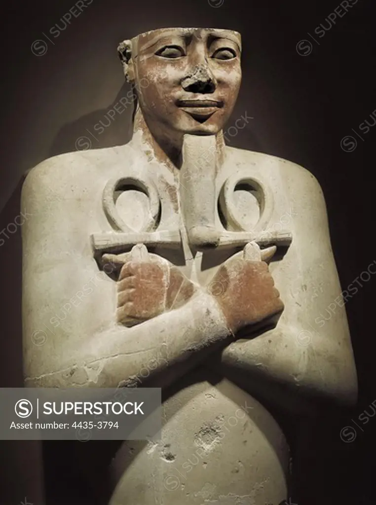 Pharaoh figure holding the life symbol between both hands. 16th-14th c. BC. 18th Dynasty. Egyptian art. New Kingdom. Sculpture. EGYPT. QUENA. Luxor. Luxor Museum. Proc: EGYPT. QUENA. Karnak. Thebes. Temple of Amon - Ra.