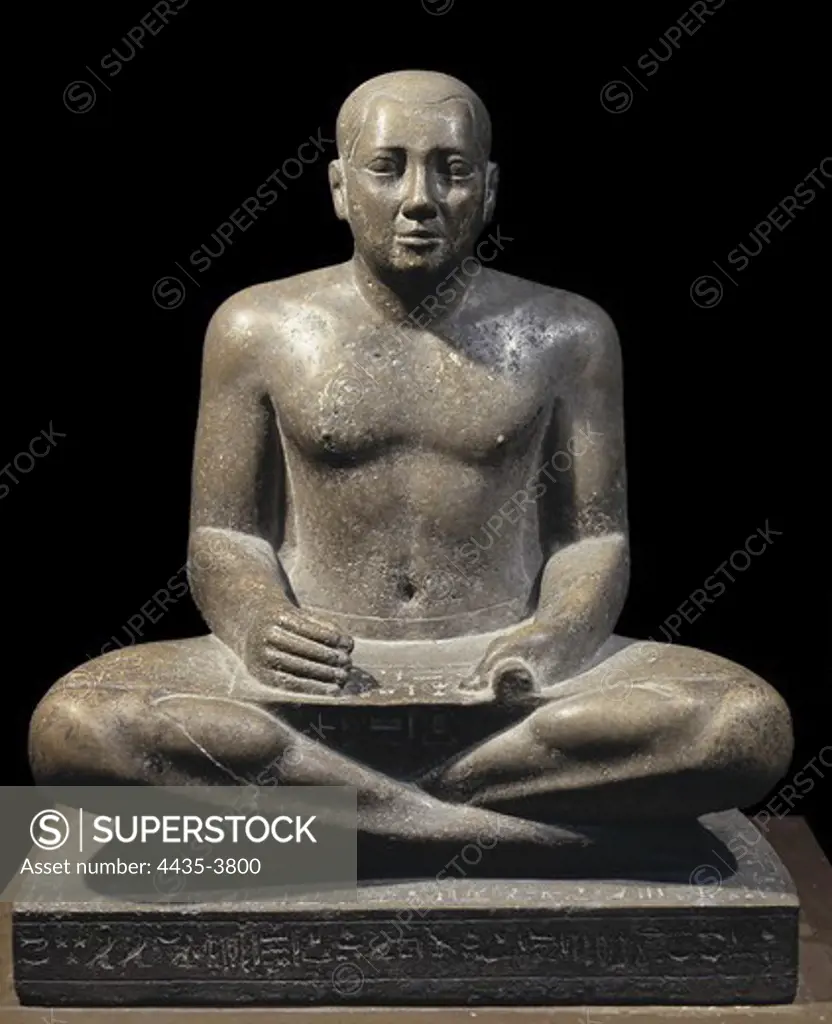 Petamenophis. 712 - 657 BC. Petamenophis (Nut) represented as scribe. Sculpture from the 25th Dynasty. Egyptian art. Third Intermediate Period. Sculpture on rock. EGYPT. CAIRO. Cairo. Egyptian Museum. Proc: EGYPT. QUENA. Karnak.