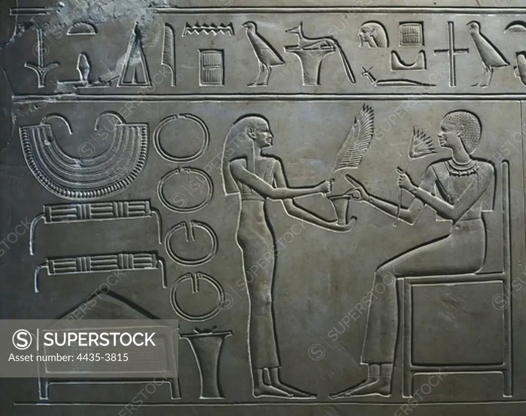 Sarcophagus of Queen Kawit. 2040 BC. Detail with the representation of Queen Kawit sniffing the scent of lotus, symbol of the life. Egyptian art. Middle Kingdom. Relief on rock. EGYPT. CAIRO. Cairo. Egyptian Museum. Proc: EGYPT. QUENA. Dayr al-Bahri. Mortuary Temple of Mentuhotep II.
