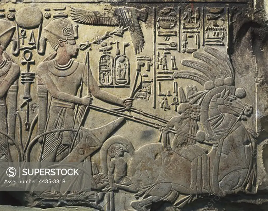 Stela of Amenhotep III. 1391 BC - 1353 BC. Amenhotep III in his war chariot. This stela was reutilized as building material. Egyptian art. New Kingdom. Relief on rock. EGYPT. CAIRO. Cairo. Egyptian Museum. Proc: EGYPT. QUENA. Dayr al-Bahri. Valley of the Kings.