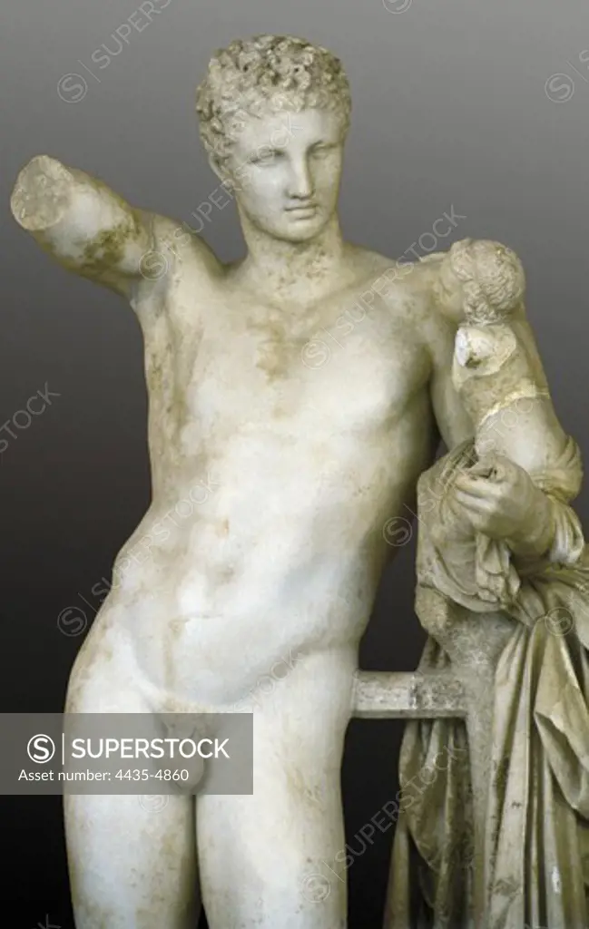 PRAXITELES (flourished 370, -330 BC). Hermes bearing the infant Dionysus. ca.  330 BC. Hermes carrying the child Dionysus to the nymphs who were charged with his rearing. Classical Greek art. Sculpture on marble. GREECE. WESTERN GREECE. ELIS. Olympia. Archaeological Museum of Olympia. Proc: GREECE. WESTERN GREECE. ELIS. Olympia.