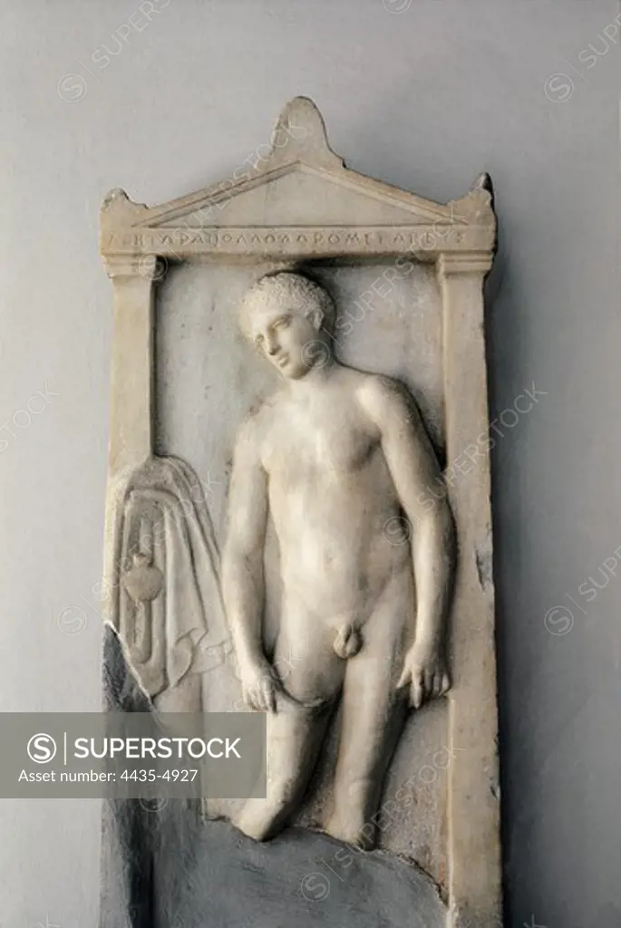 Athlete giving himself a massage with a strigil. 4th c. BC. Classical Greek art. Relief on marble. GREECE. ATTICA. Athens. Piraeus. Archaeological Museum of Piraeus.