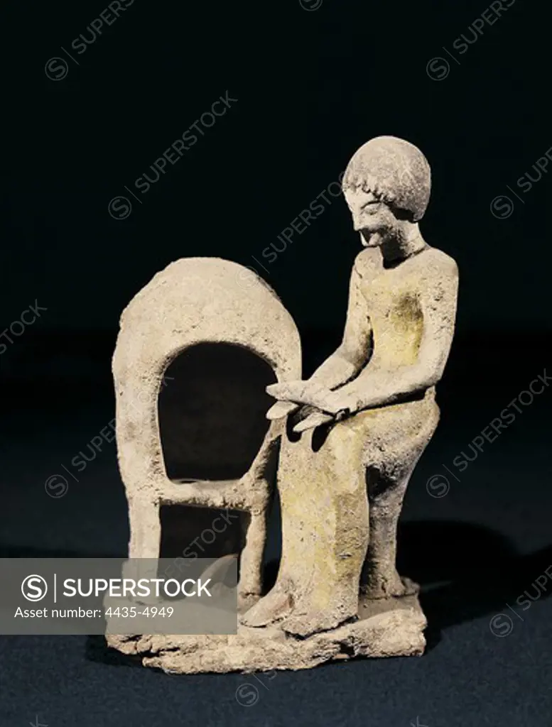 Figure of Woman next to an Oven. ca. 1550 BC - 1100 BC. Mycenaean art. Terra-cotta. FRANCE. ALSACE. BAS-RHIN. Strasbourg. Archaeological Museum. Proc: GREECE. PELOPONNESE. ARCADIA. Mycenae.