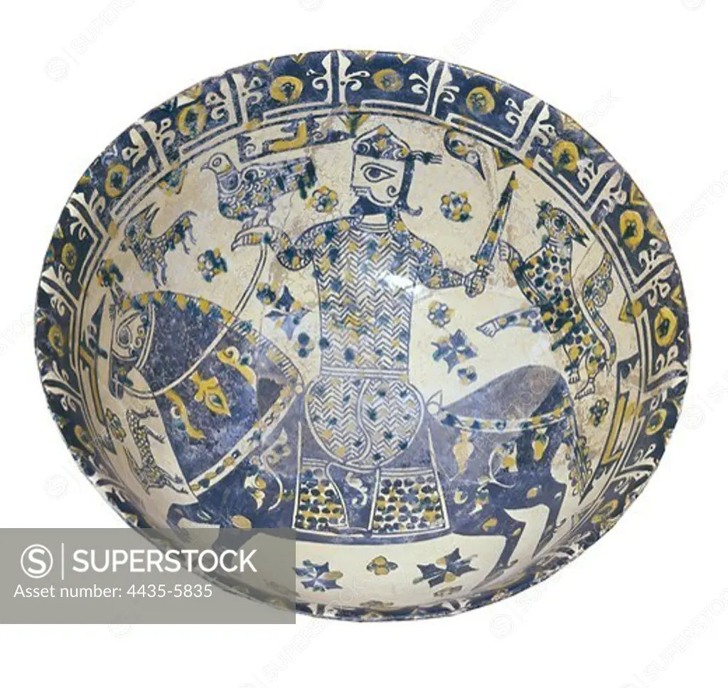 Plate decorated with a warrior, 10th c. Glazed Terracotta. Persian art. Ceramics. IRAN. Tehran. Iran's National Museum. Foroughi collection.