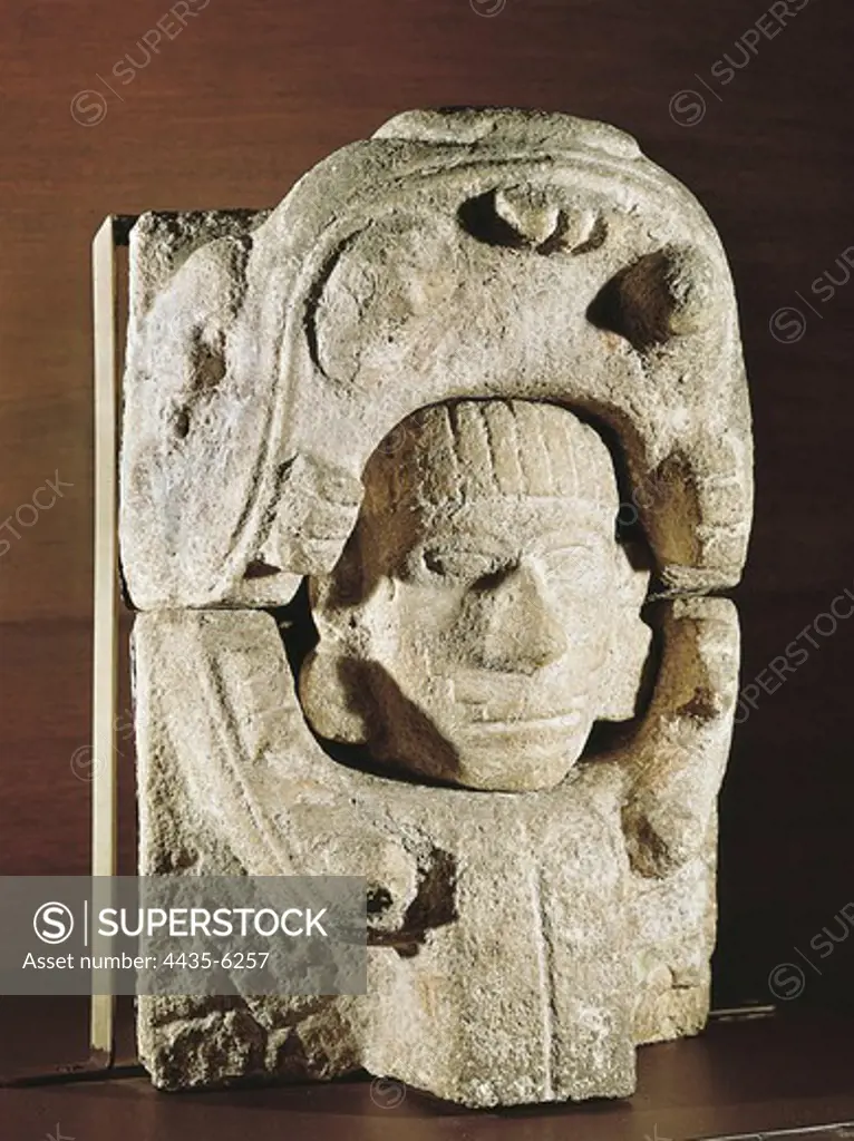 Human head going out from animal's jaws. 950-1200. Late classical period. Clay. Maya art. Sculpture on rock. MEXICO. FEDERAL DISTRICT. Mexico City. National Museum of Anthropology. Proc: MEXICO. YUCATçN. ChichŽn Itz.